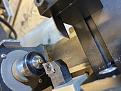 Turning a section of the larger main gears down to remove the teeth to the minor diameter to create clearance for the smaller gears major diameter